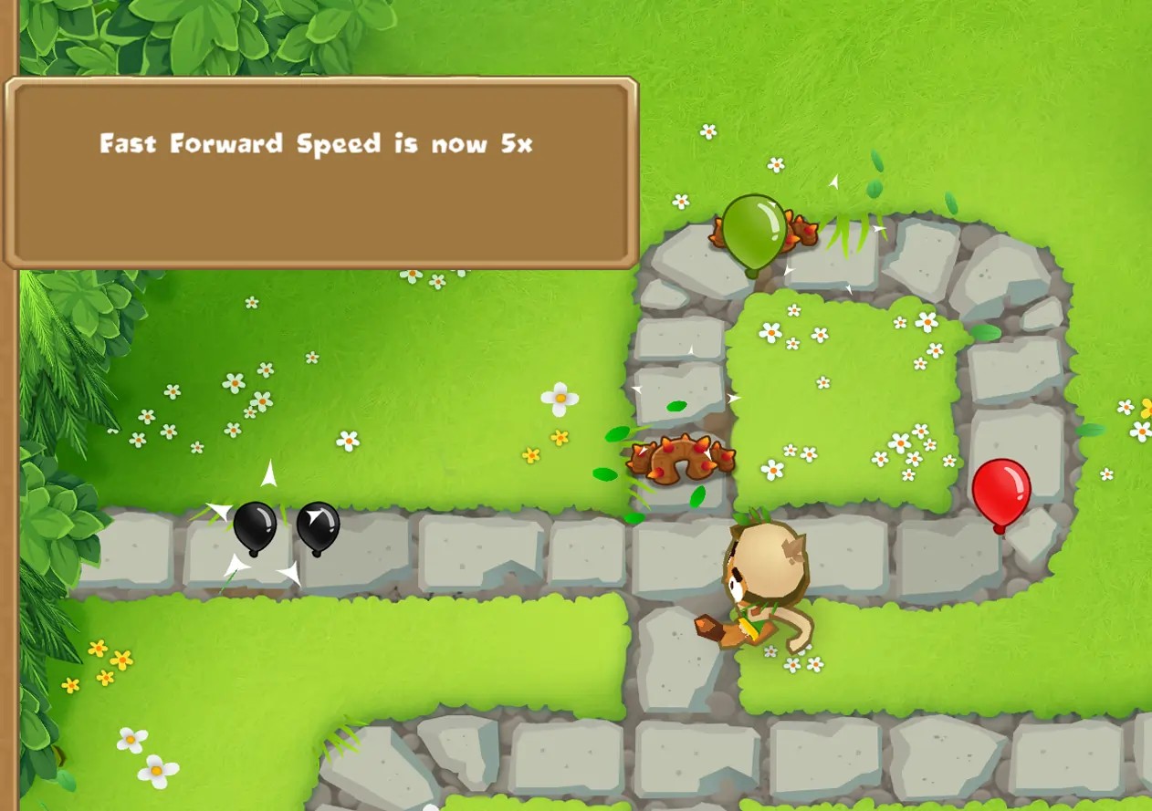 A gameplay screenshot in Bloons TD 6 displaying the message "Fast Forward Speed is now 5x," indicating the use of a mod that increases the game's fast forward speed.