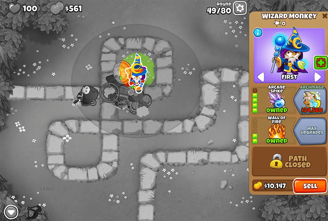 Bloons TD 6 screenshot of Round 49 on Monkey Meadow with Magic Monkeys only. The Wizard Monkey, selected and upgraded with Arcane Spike and Wall of Fire, is centrally positioned. Also visible are an Alchemist and Ninja Monkey, all defending against incoming bloons.