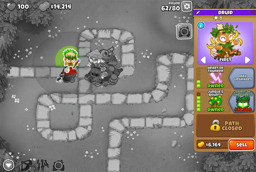 Bloons TD 6 screenshot of Round 62 on Monkey Meadow with Magic Monkeys only. A Druid, selected and upgraded with Heart of Thunder, Jungle's Bounty.