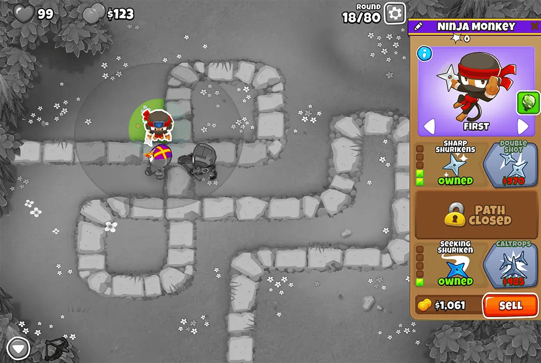 Bloons TD 6 screenshot of Round 18 on Monkey Meadow for Double HP MOABs mode. A Ninja Monkey, selected and upgraded with Sharp Shurikens, is shown. Also present is Quincy, both beginning to set up the defense.