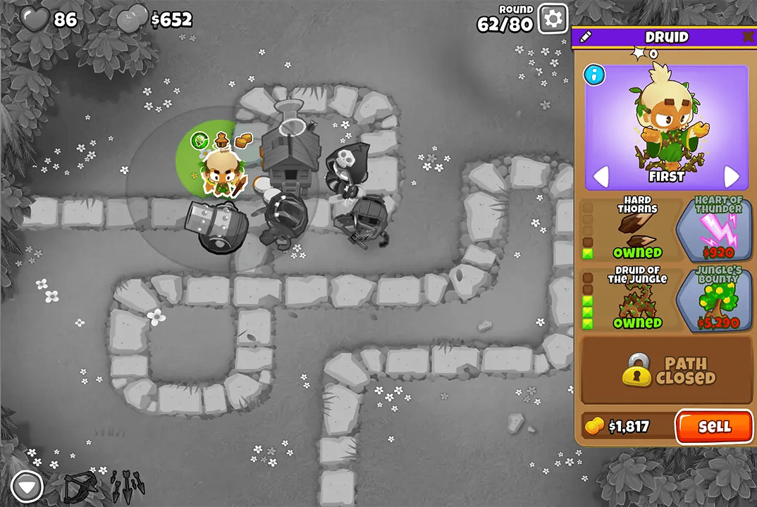 Bloons TD 6 screenshot of Round 62 on Monkey Meadow for Half Cash mode. The Druid is selected, showing its upgrades like Hard Thorns and Druid of the Jungle.