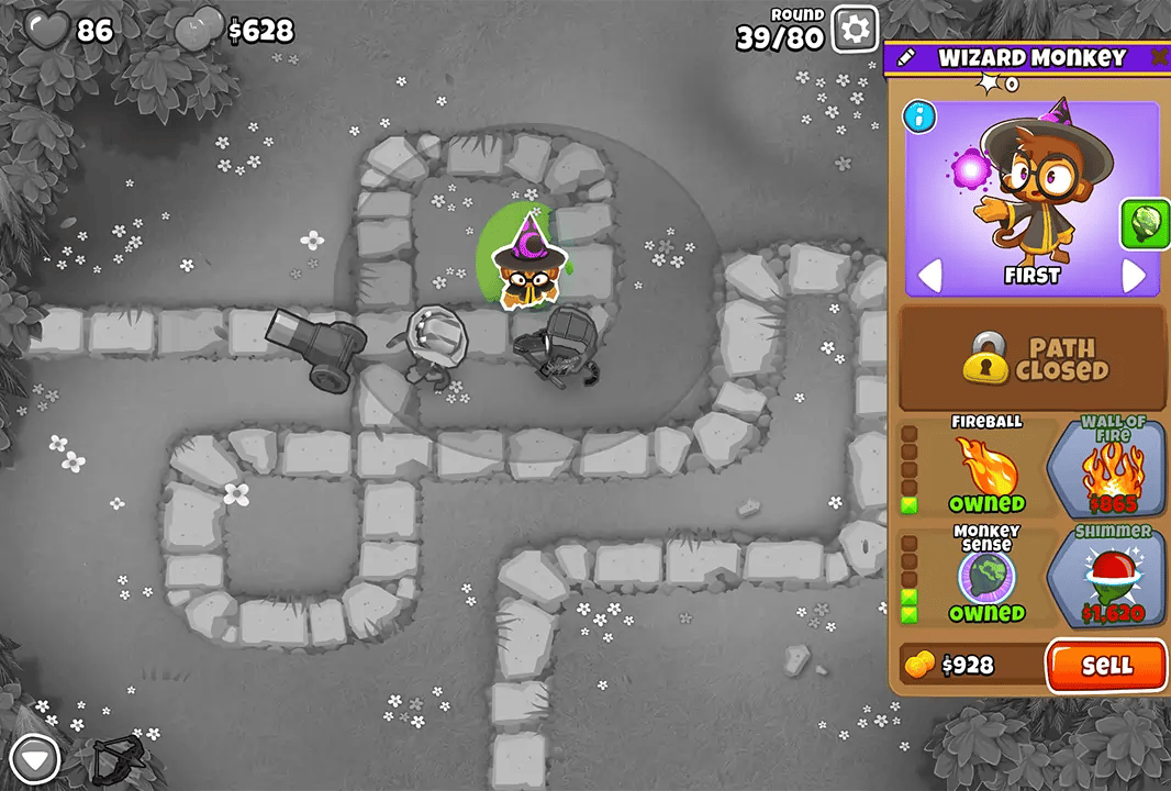 Bloons TD 6 screenshot of Round 39 on Monkey Meadow for Half Cash mode. The Wizard Monkey is selected, displaying its upgrades like Fireball and Wall of Fire. Other monkeys including Quincy and Bomb Shooters are positioned for defense.