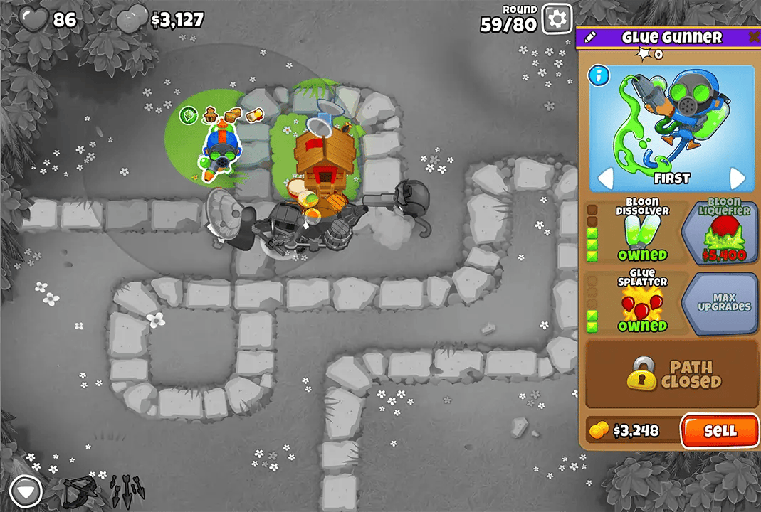 Bloons TD 6 gameplay on the Monkey Meadow map during round 59, showing a Glue Gunner and various other monkey towers placed along the path. The upgrade menu for the Glue Gunner is visible on the right.