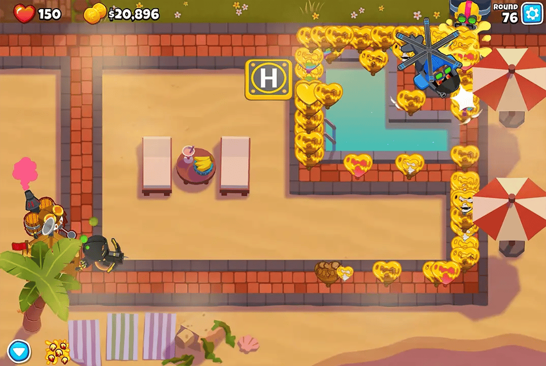 Screenshot of a regrow farm strategy in round 86 on a beach map in BTD6. The setup includes a Downdraft Heli Pilot, Glue Strike Glue Gunner, Crossbow Master Dart Monkey, all buffed with a Monkey Village and an Alchemist, with regrowing heart balloons surrounding the defenses.