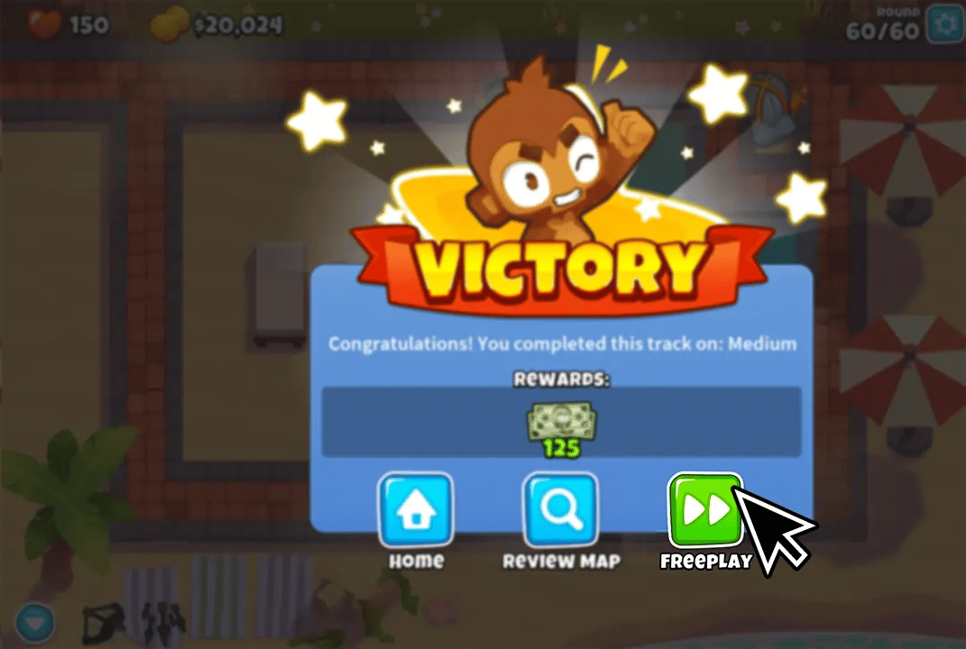 A "Victory" screen in BTD6 after completing a track on Medium difficulty. The screen shows a monkey celebrating with a "Freeplay" option highlighted at the bottom right for players who wish to continue.