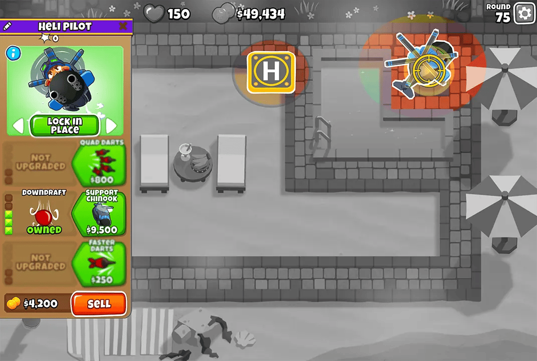 BTD6 game screen showcasing a Heli Pilot with the Downdraft upgrade, locked in place over a pool in round 75. The menu on the left displays the Heli Pilot's upgrade options and stats.